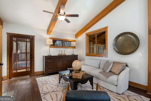 living room with lofted ceiling with beams, light wood-style flooring, and baseboards