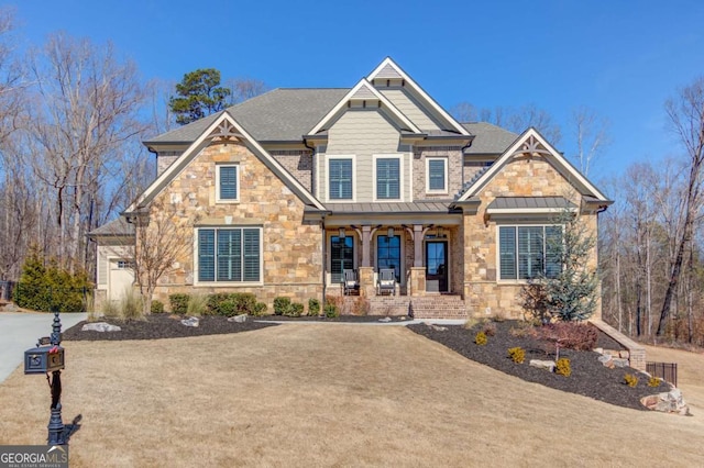 craftsman inspired home featuring stone siding, covered porch, metal roof, and a standing seam roof