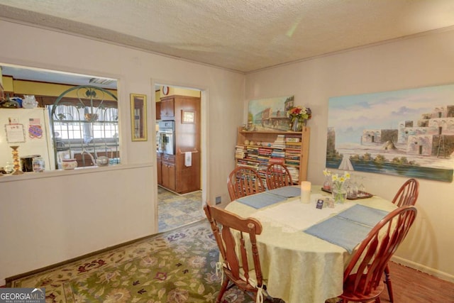 dining room featuring a textured ceiling