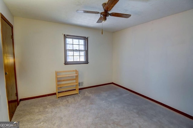 unfurnished bedroom with light carpet, ceiling fan, and baseboards