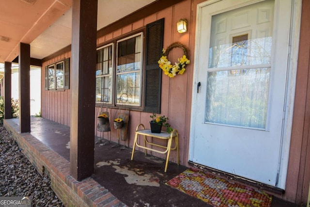 property entrance with covered porch