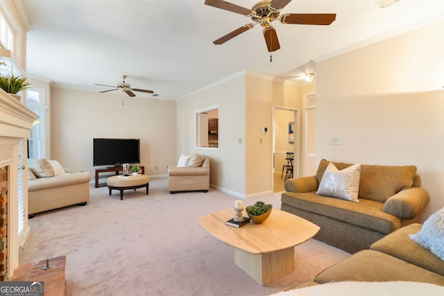 living area with crown molding, a fireplace, light colored carpet, ceiling fan, and baseboards