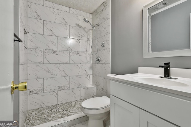 full bath with toilet, a stall shower, marble finish floor, and vanity