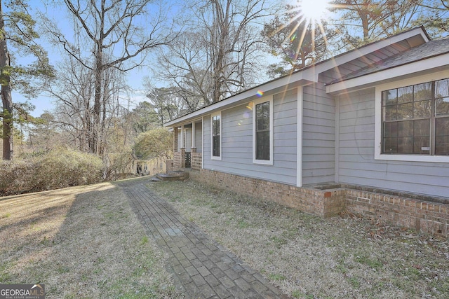 view of home's exterior with a lawn