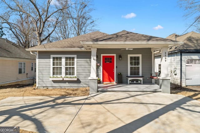 view of front of property featuring covered porch and roof with shingles