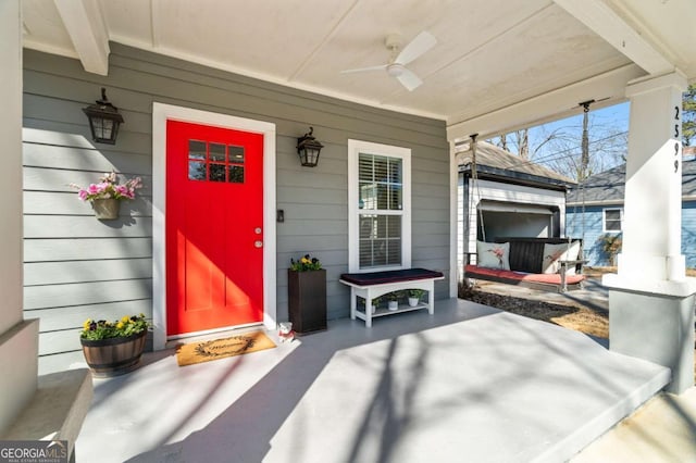 doorway to property with a ceiling fan