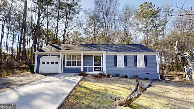 ranch-style house featuring an attached garage, covered porch, concrete driveway, crawl space, and a front yard