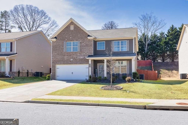 traditional-style house with brick siding, driveway, a front lawn, and central AC unit