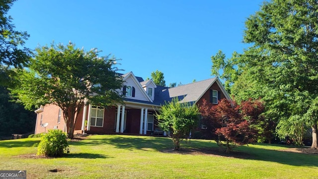 new england style home with a front yard