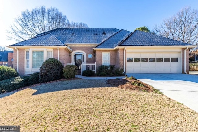 single story home with a garage, driveway, brick siding, and roof with shingles