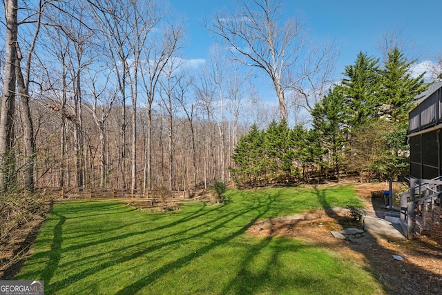 view of yard featuring a view of trees