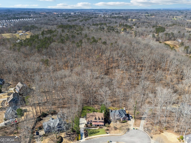 aerial view featuring a view of trees