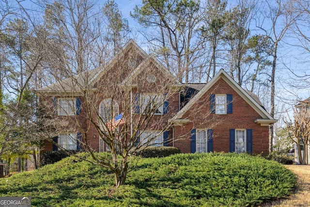 view of front of home featuring brick siding