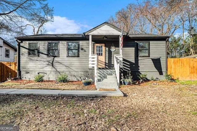 bungalow featuring crawl space and fence