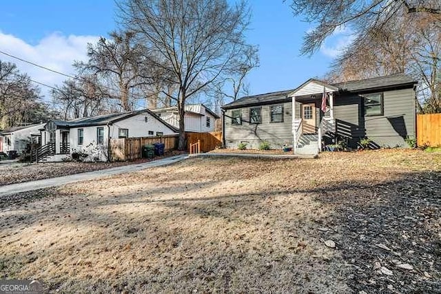 view of front of house with fence