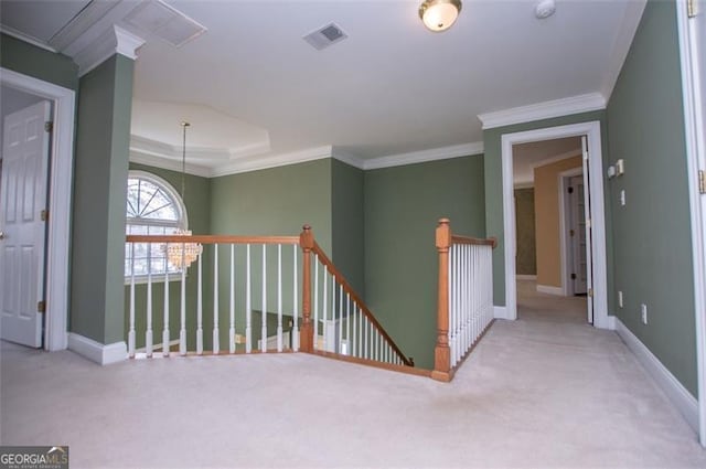 corridor with baseboards, visible vents, ornamental molding, and an upstairs landing