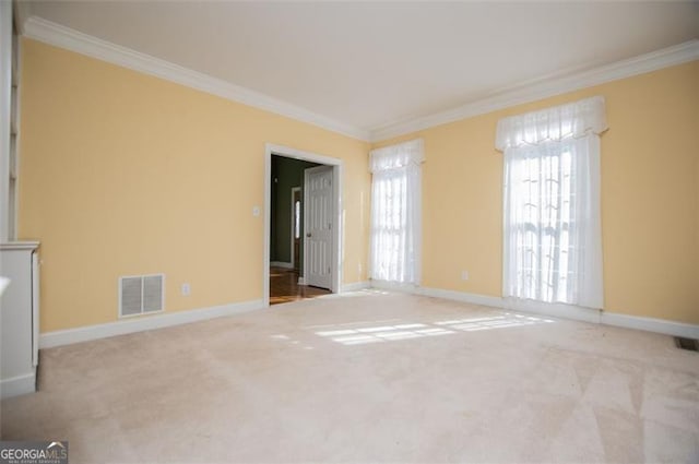 unfurnished living room with ornamental molding, visible vents, and light carpet