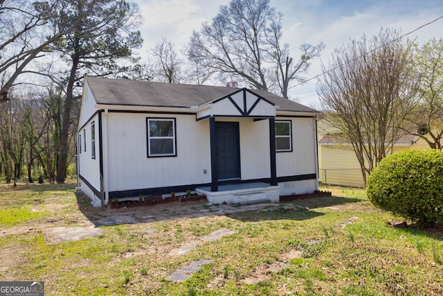 view of front of house featuring a shingled roof