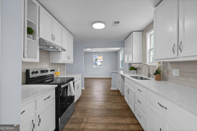 kitchen featuring electric stove, a sink, under cabinet range hood, white cabinetry, and visible vents