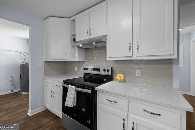 kitchen featuring under cabinet range hood, dark wood finished floors, stainless steel electric range, and white cabinetry