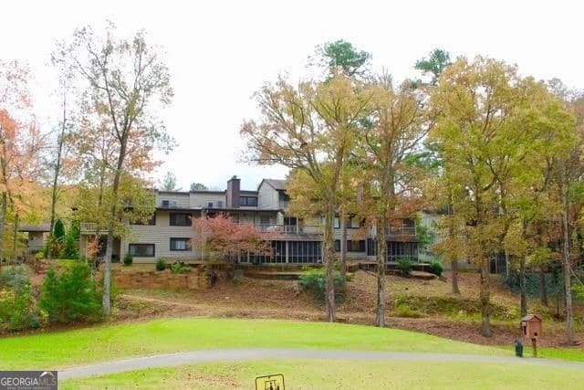 view of home's community featuring a lawn