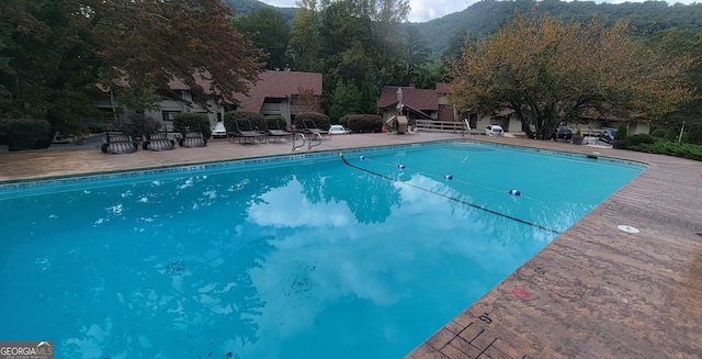 outdoor pool with a patio