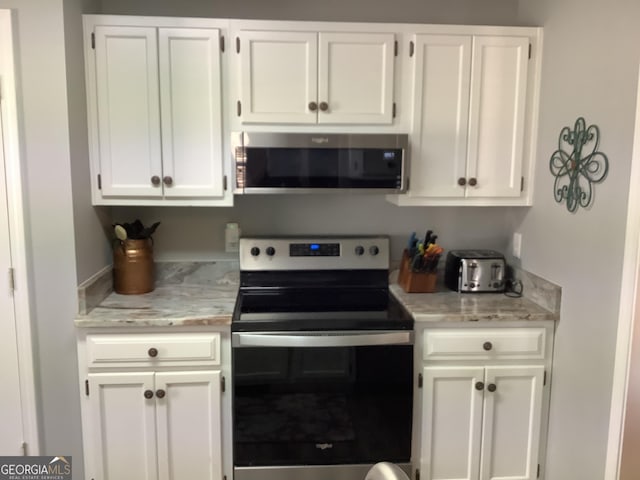 kitchen with white cabinets and stainless steel appliances