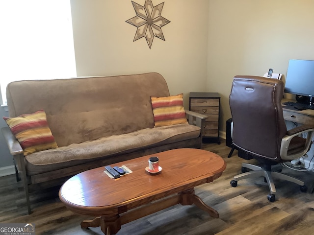 office area featuring baseboards and wood finished floors