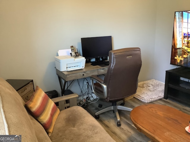 office space with wood finished floors