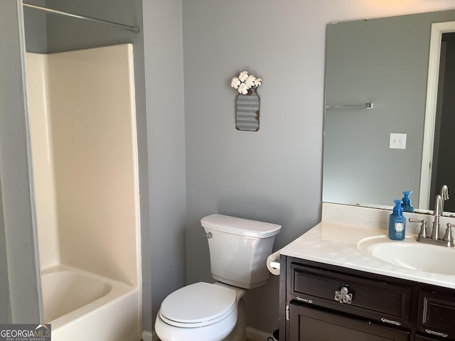 bathroom featuring toilet, bathtub / shower combination, and vanity