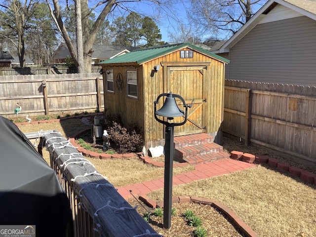 view of shed featuring a fenced backyard