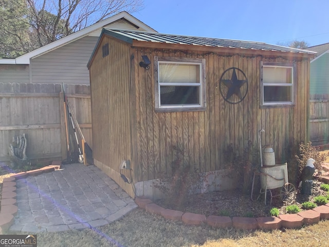 view of outdoor structure featuring fence