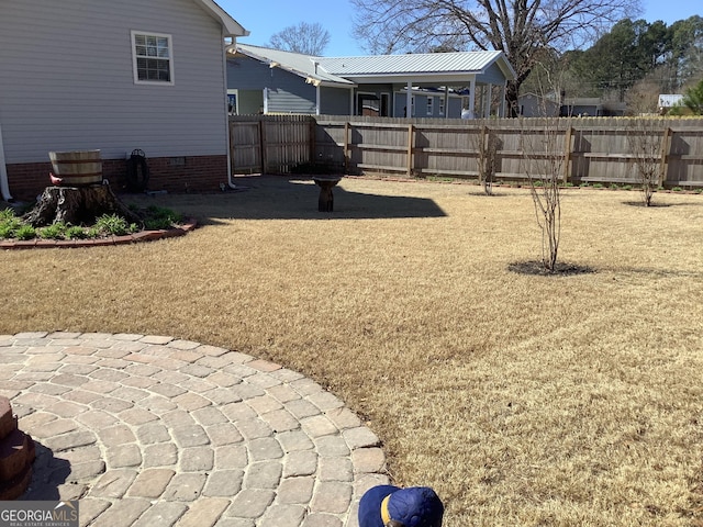 view of yard featuring a patio area and a fenced backyard