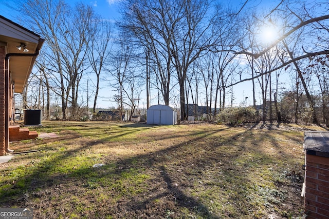 view of yard with a storage unit, an outdoor structure, and cooling unit