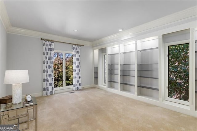 carpeted spare room featuring baseboards, ornamental molding, and recessed lighting