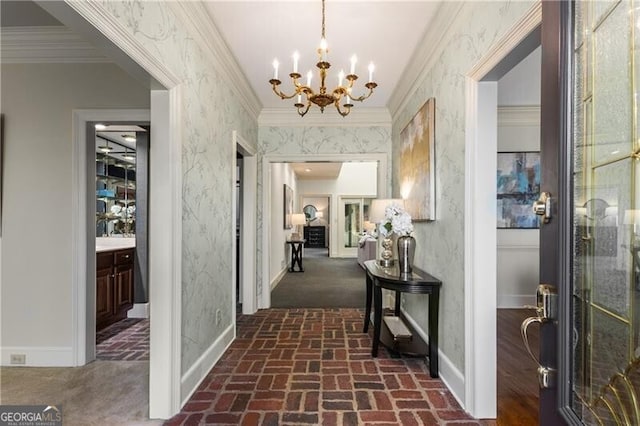 corridor with brick floor, ornamental molding, baseboards, and wallpapered walls