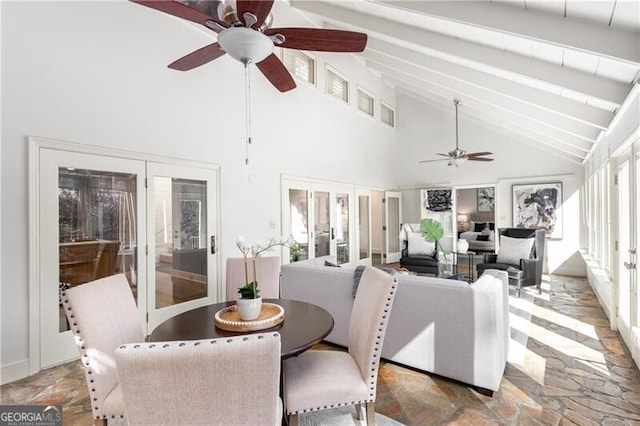 sunroom featuring french doors, vaulted ceiling with beams, and ceiling fan