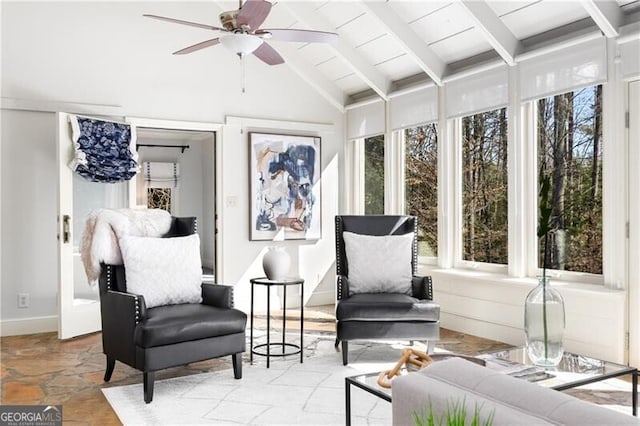 sunroom with vaulted ceiling with beams, ceiling fan, and wood ceiling