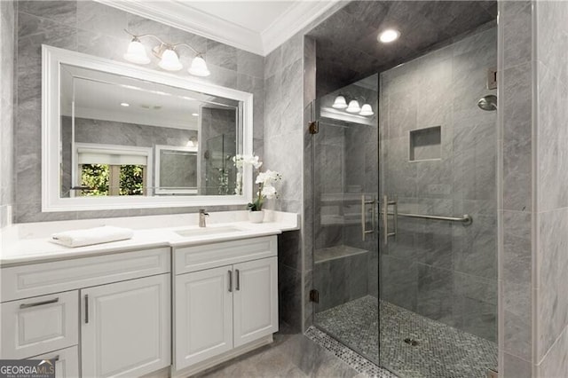 bathroom featuring ornamental molding, a stall shower, and vanity