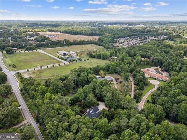 aerial view with a wooded view