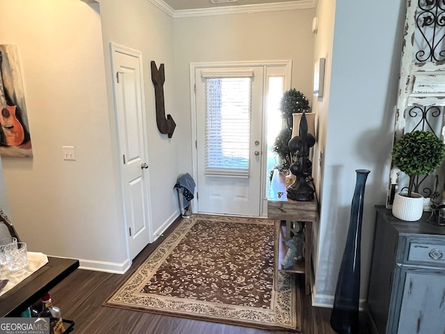 foyer with baseboards, ornamental molding, and dark wood-type flooring