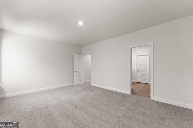 interior space featuring recessed lighting, carpet flooring, and baseboards