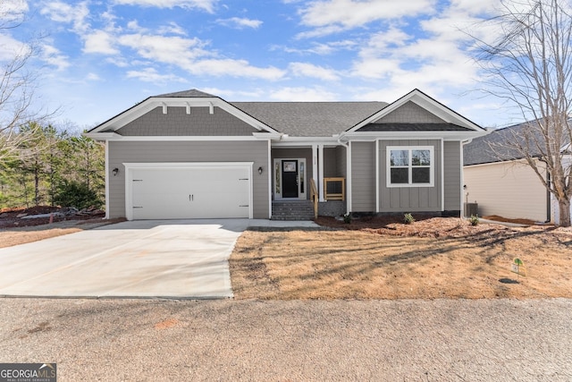 view of front of property with concrete driveway and an attached garage