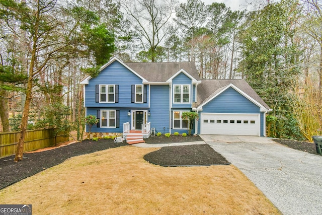 view of front facade with aphalt driveway, a garage, a shingled roof, fence, and a front lawn