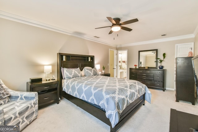 bedroom with baseboards, visible vents, connected bathroom, light colored carpet, and crown molding