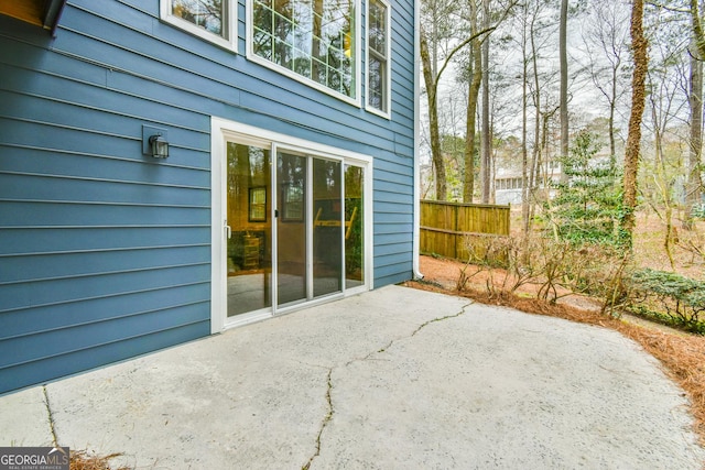 view of patio featuring fence