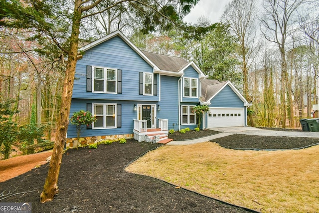 colonial home with an attached garage, driveway, a front lawn, and roof with shingles