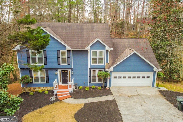 view of front of home featuring a garage and concrete driveway