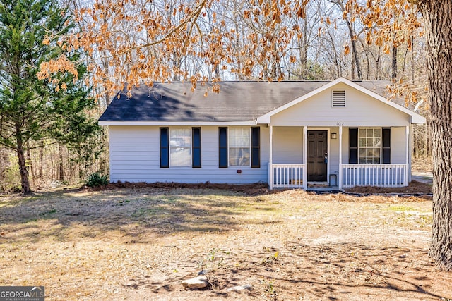 single story home featuring a front yard and covered porch