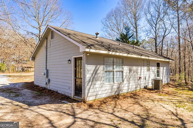 view of side of property with cooling unit